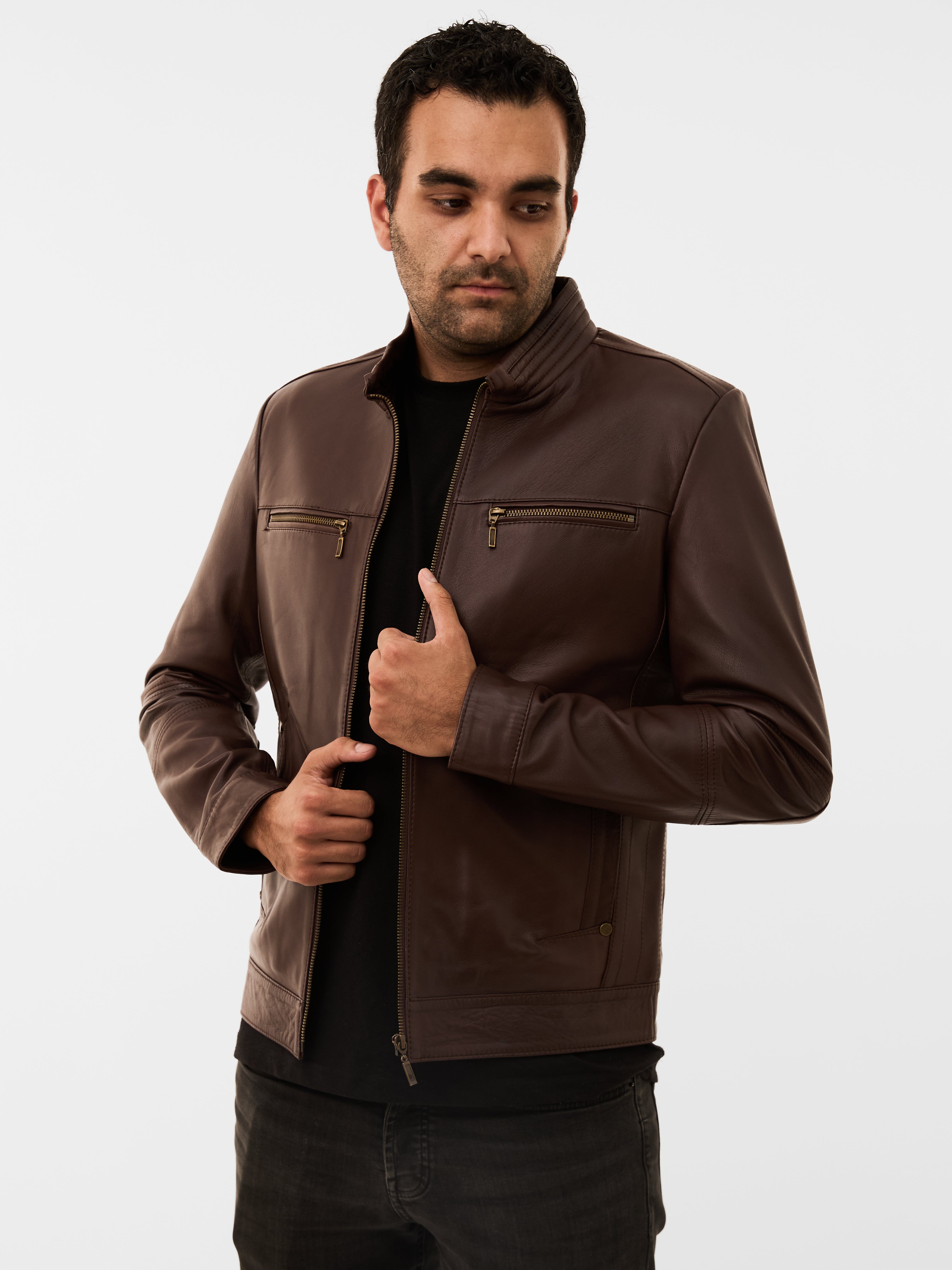 Man wearing a brown leather jacket on a white background