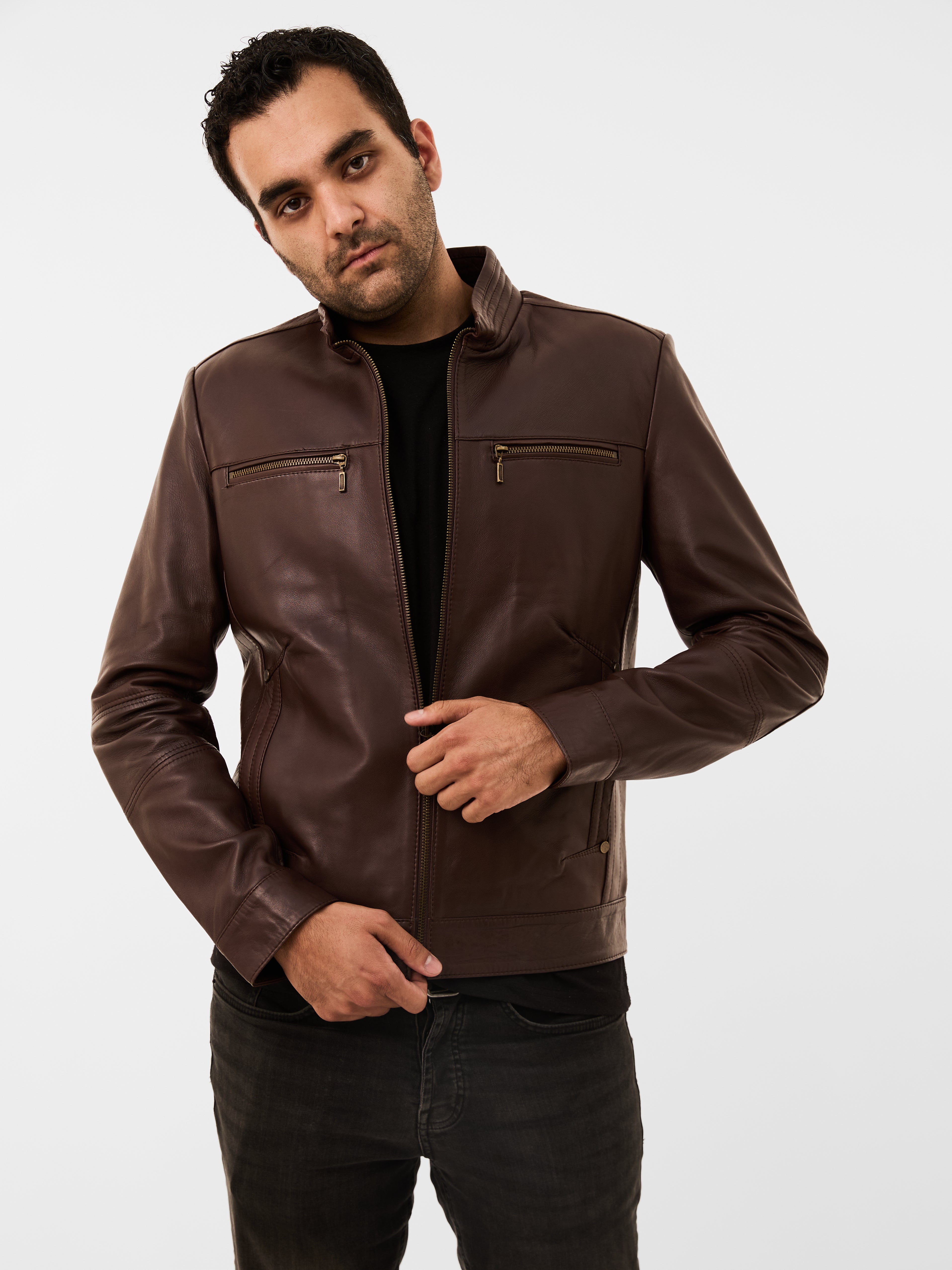 Man wearing a brown leather jacket on a white background