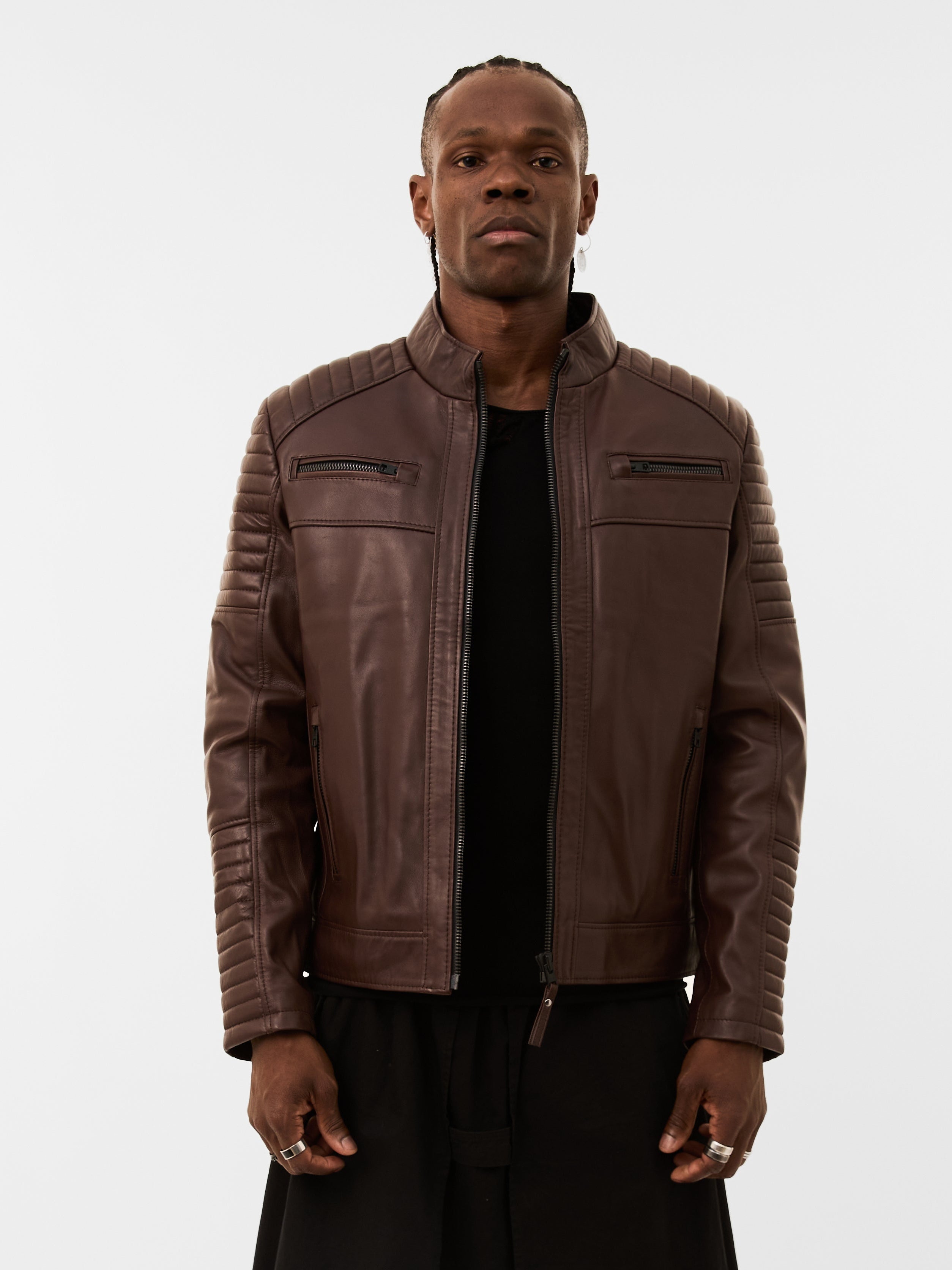 Man wearing a brown leather jacket on a white background
